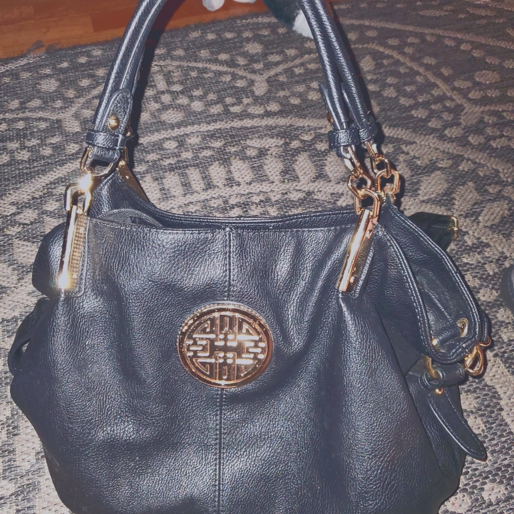 Black shoulder purse with cross body strap include